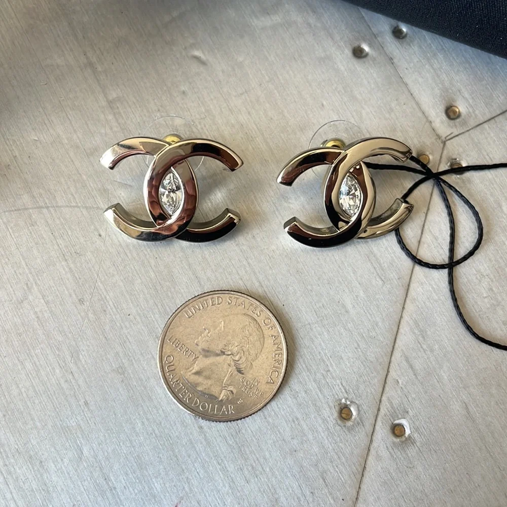 Chanel oversize gold logo earrings with crystal center with box